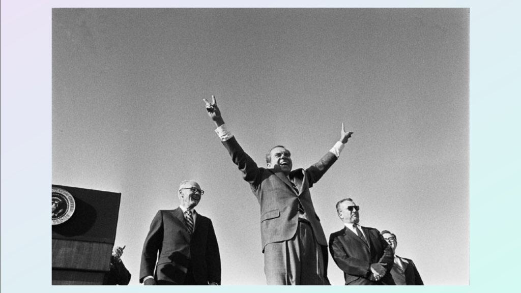 Richard NIxon, from below, give the victory wave